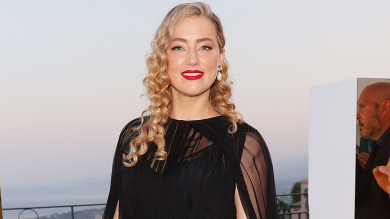 Amber Heard wearing a black dress