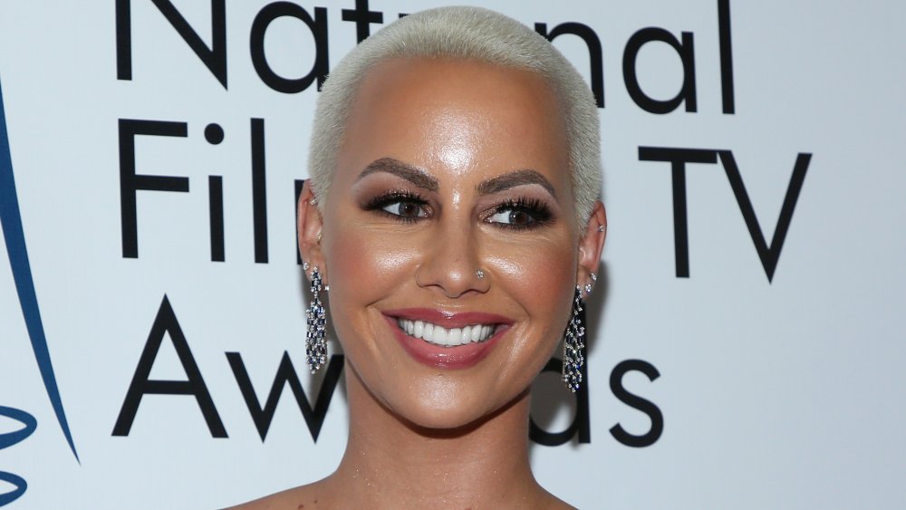 Amber Rose proudly parades her new FACE tattoo on family outing after  defending shock ink  Daily Mail Online