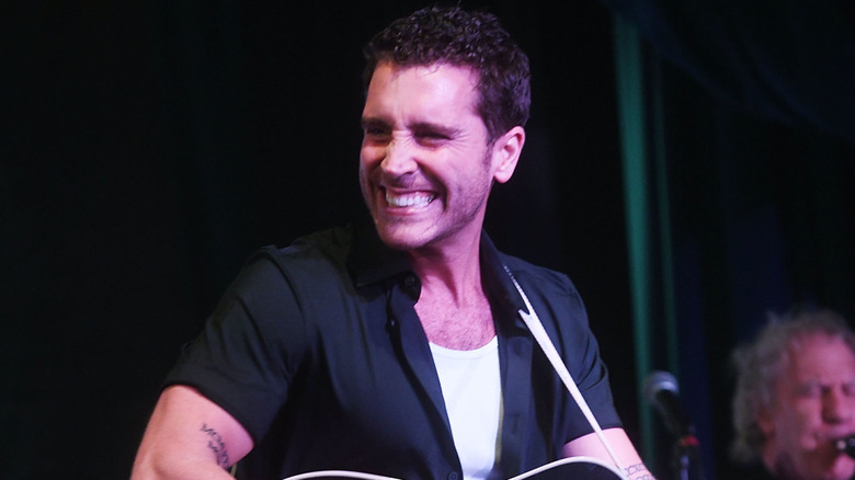 Nick Fradiani smiling while performing in New York City in October 2023