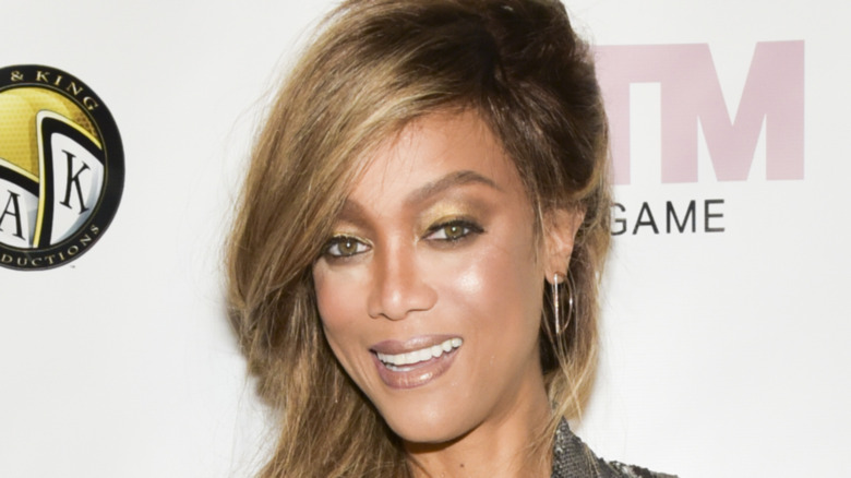 Tyra Banks arrives at the "America's Next Top Model" mobile game release