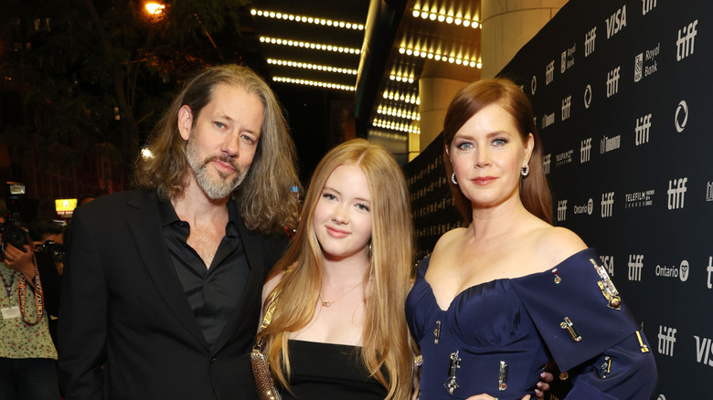 Amy Adams posing with her family