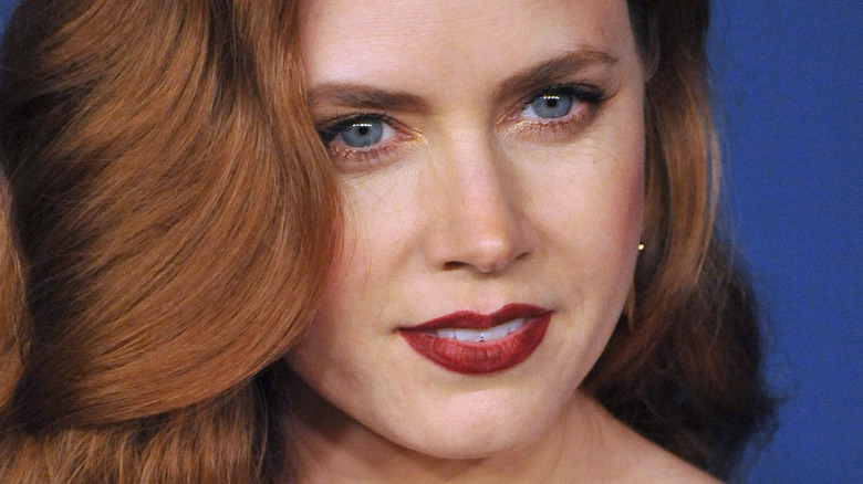 Amy Adams with her red hair pulled forward