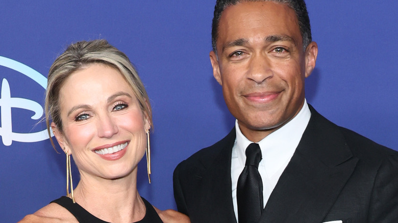 Amy Robach and T.J. Holmes smiling together