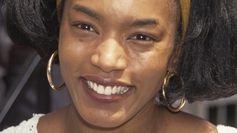 Angela Bassett with a yellow headband