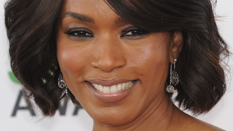 Angela Bassett wearing an orange dress