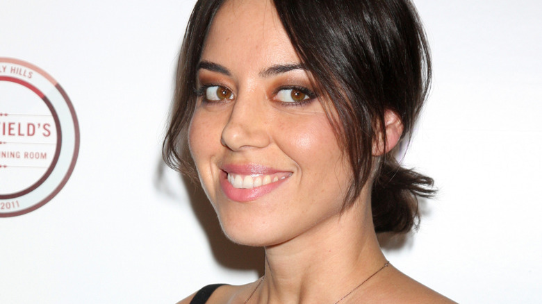 Aubrey Plaza smiles