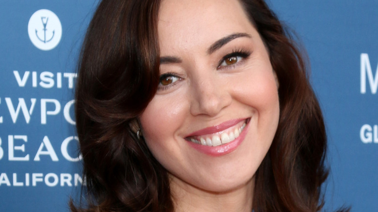 Aubrey Plaza smiles