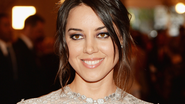 Aubrey Plaza smiles