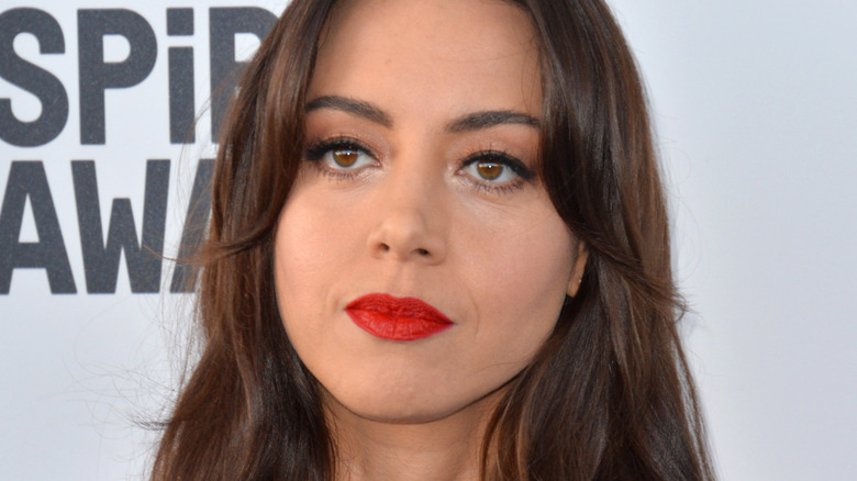 Aubrey Plaza smiles
