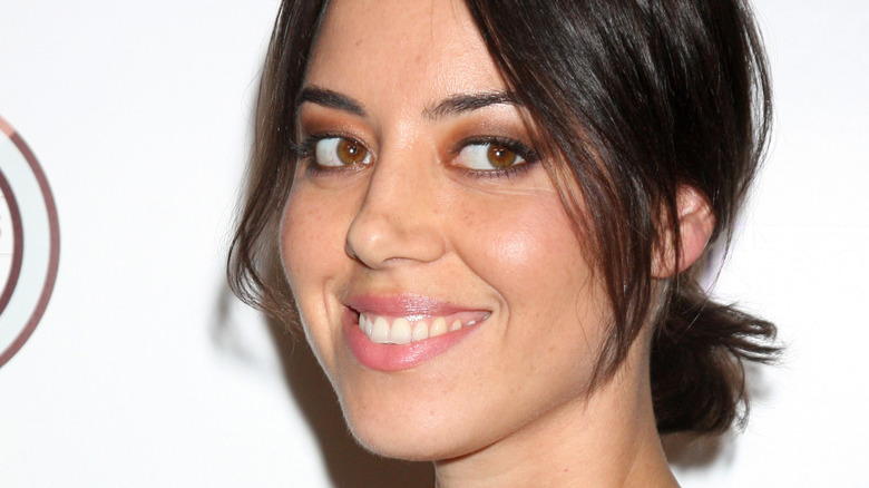 Aubrey Plaza smiles