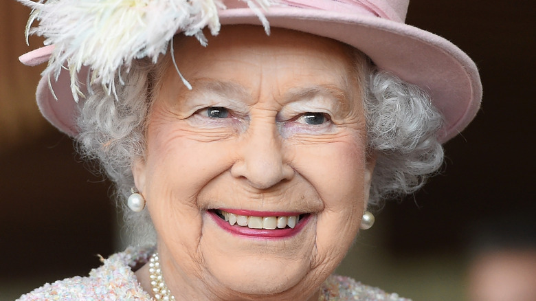 Queen Elizabeth smiles at an engagement
