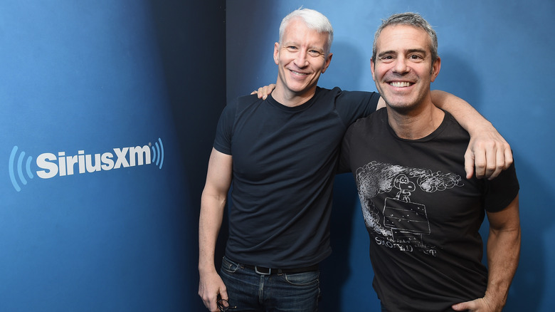 Anderson Cooper and Andy Cohen smile together