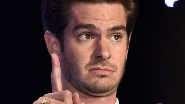 Andrew Garfield holding one finger up