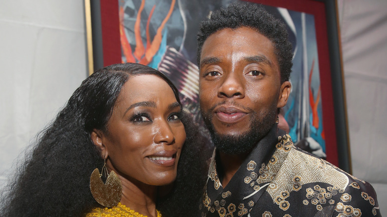 Angela Bassett and Chadwick Boseman smiling together