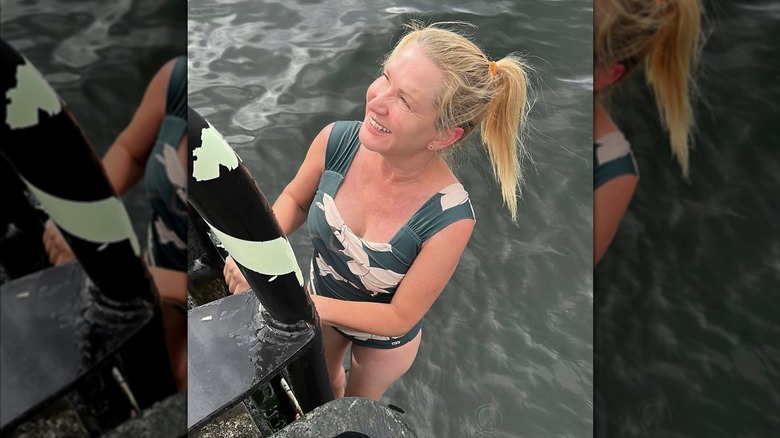 Angela Kinsey posing in a bathing suit.