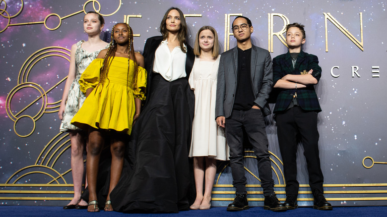 Angelina Jolie posing with her children