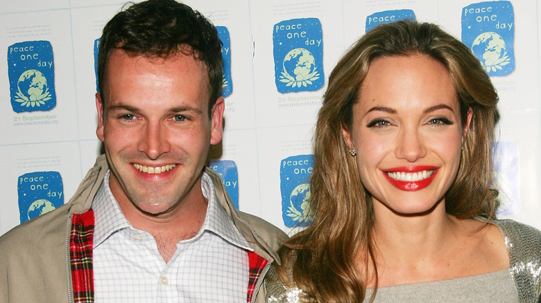 Jonny Lee Miller and Angelina Jolie smiling