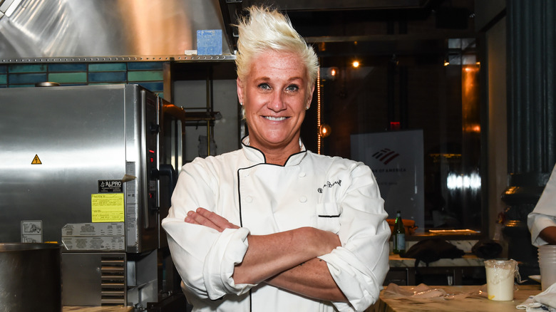Anne Burrell arms crossed in the kitchen