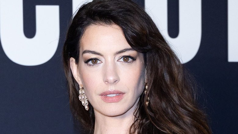 Anne Hathaway with brown hair on red carpet