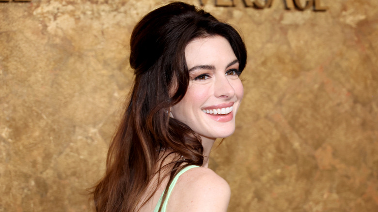 Anne Hathaway laughing