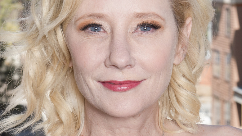 Anne Heche with pink lipstick and her signature blonde hair
