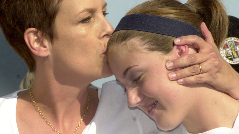 Jamie Lee Curtis kisses Annie Guest on the forehead