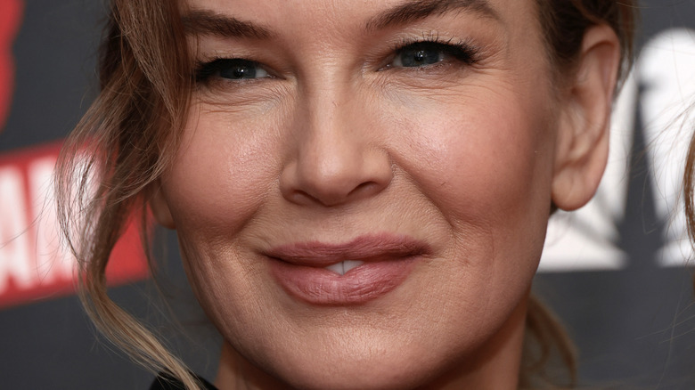 Renee Zellweger hair up pink lipstick