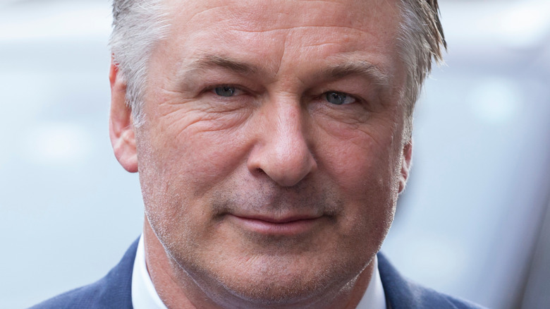 Alec Baldwin smiling coyly