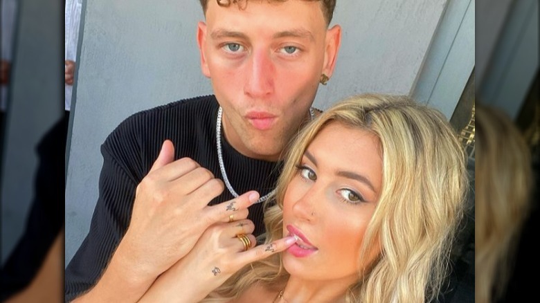 Carly Lawrence and Joey of "Too Hot To Handle" taking a selfie