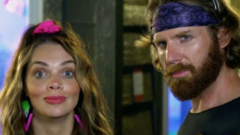 Gina and Clint pose at an '80s party on Married at First Sight 