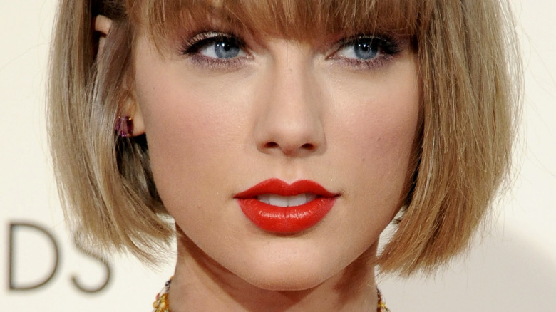 Taylor Swift smiling red lipstick