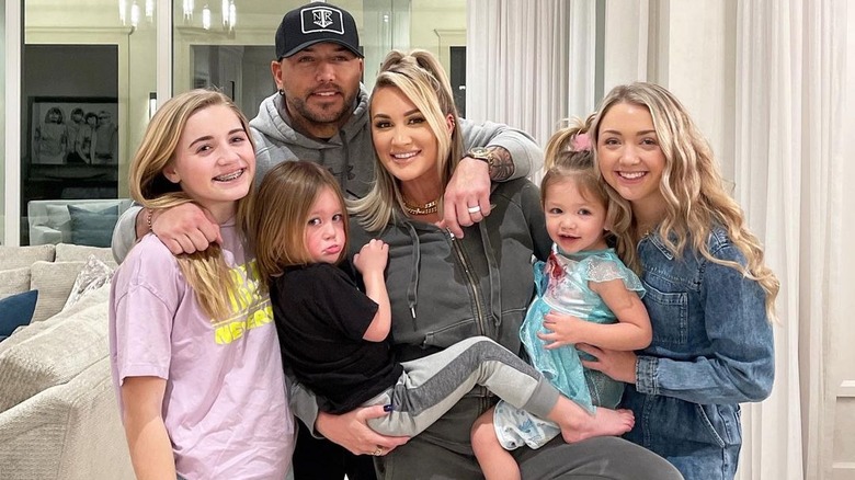 Brittany Aldean poses with her blended family