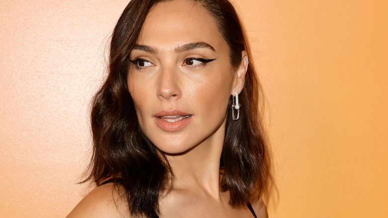 Gal Gadot looking over her shoulder 