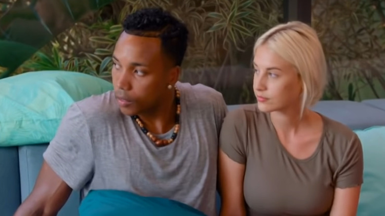 Kendal and Alexcys sit together on the couch