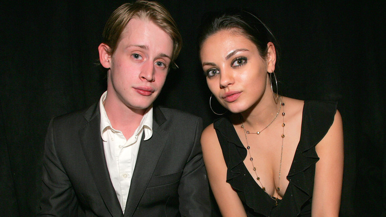 Macaulay Culkin and Mila Kunis smiling