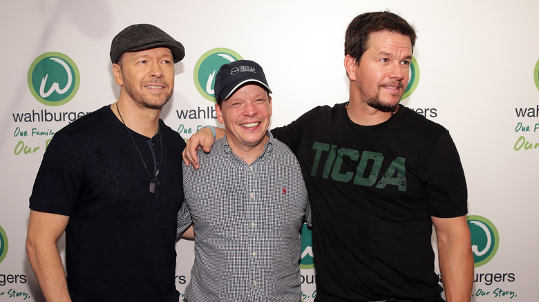 Mark Wahlberg, Donnie Wahlberg, and Paul Wahlberg smiling at an event