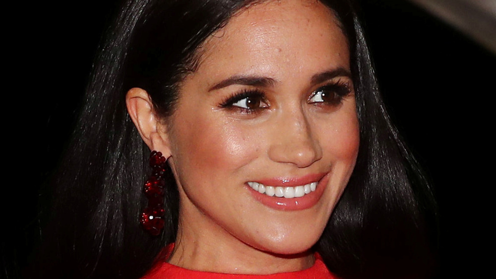 Meghan Markle smiling at an event