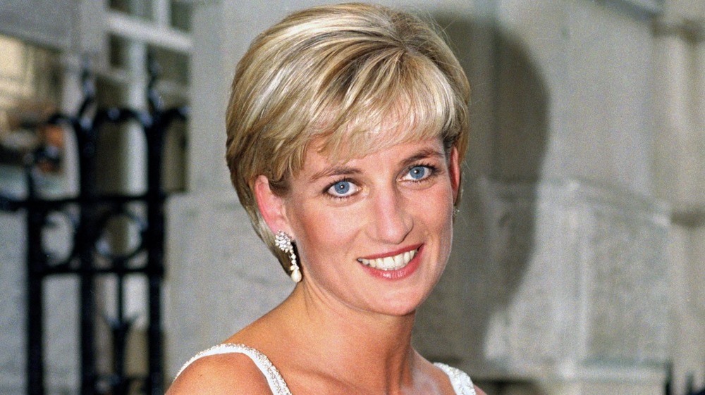 Princess Diana wearing diamond earrings at an event