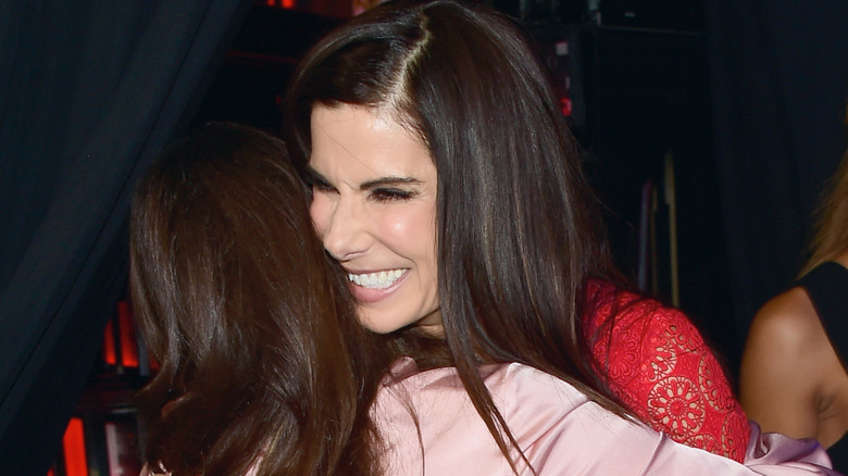 Sandra Bullock and Melissa McCarthy hugging