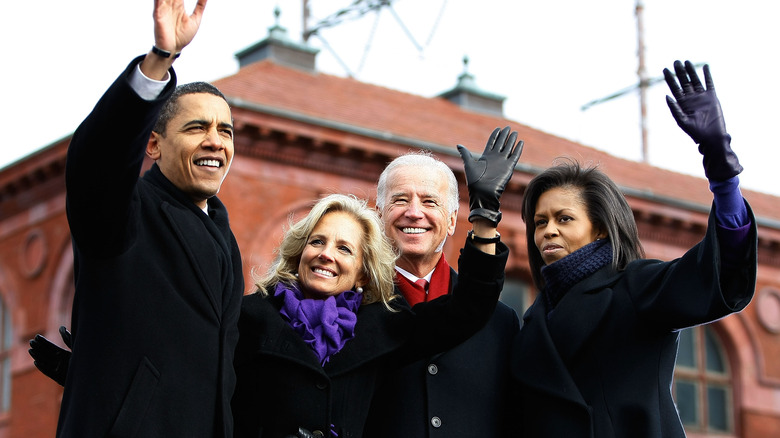 The Obamas and Bidens wave