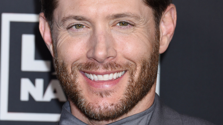 Jensen Ackles smiling on the red carpet