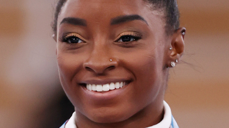 Simone Biles smiling at Olympics