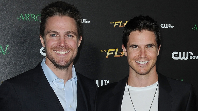 Stephen Amell and Robbie Amell smiling