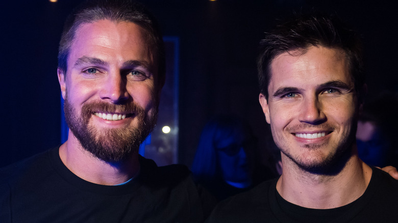 Stephen Amell and Robbie Amell smiling