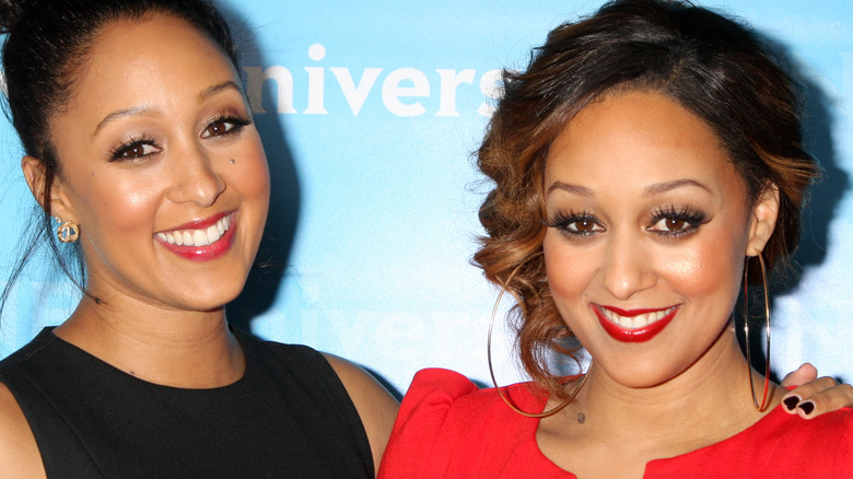 Tamera Mowry and Tia Mowry smiling