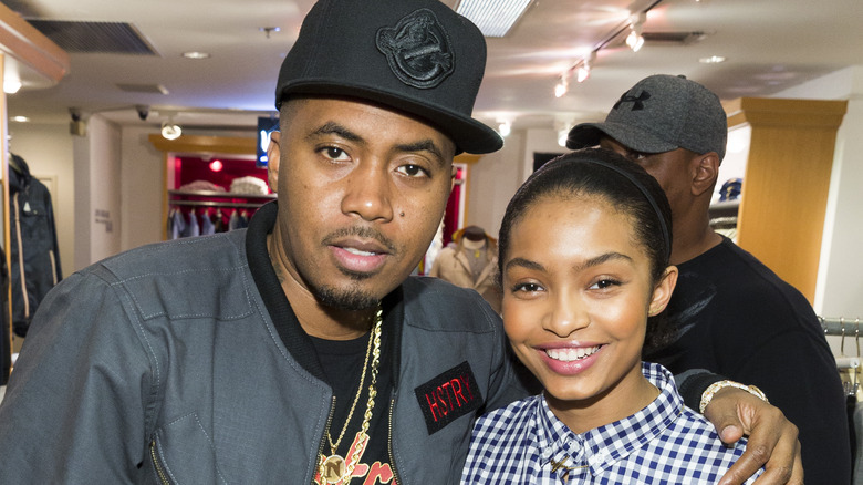 Nas and Yara Shahidi pose at an event