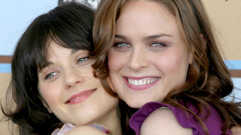 Zooey and Emily Deschanel hugging