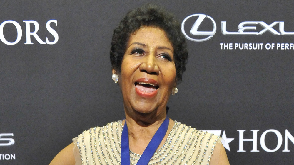 Aretha Franklin posing on the red carpet 