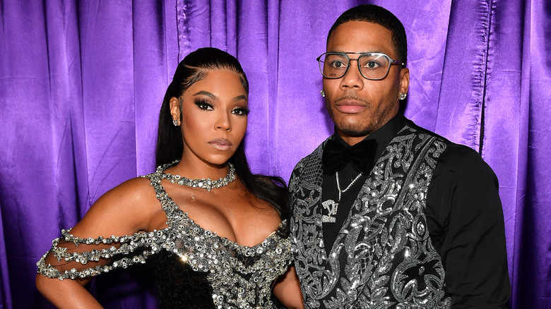 Ashanti and Nelly posing