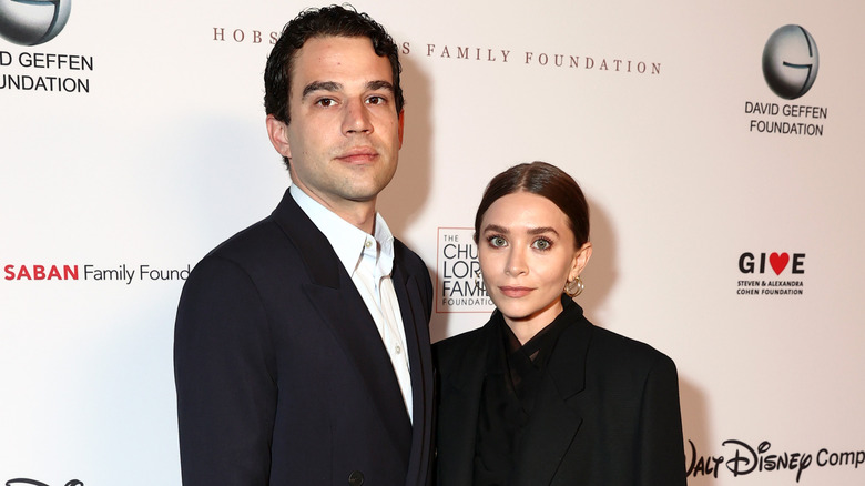 Louis Eisner and Ashley Olsen posing